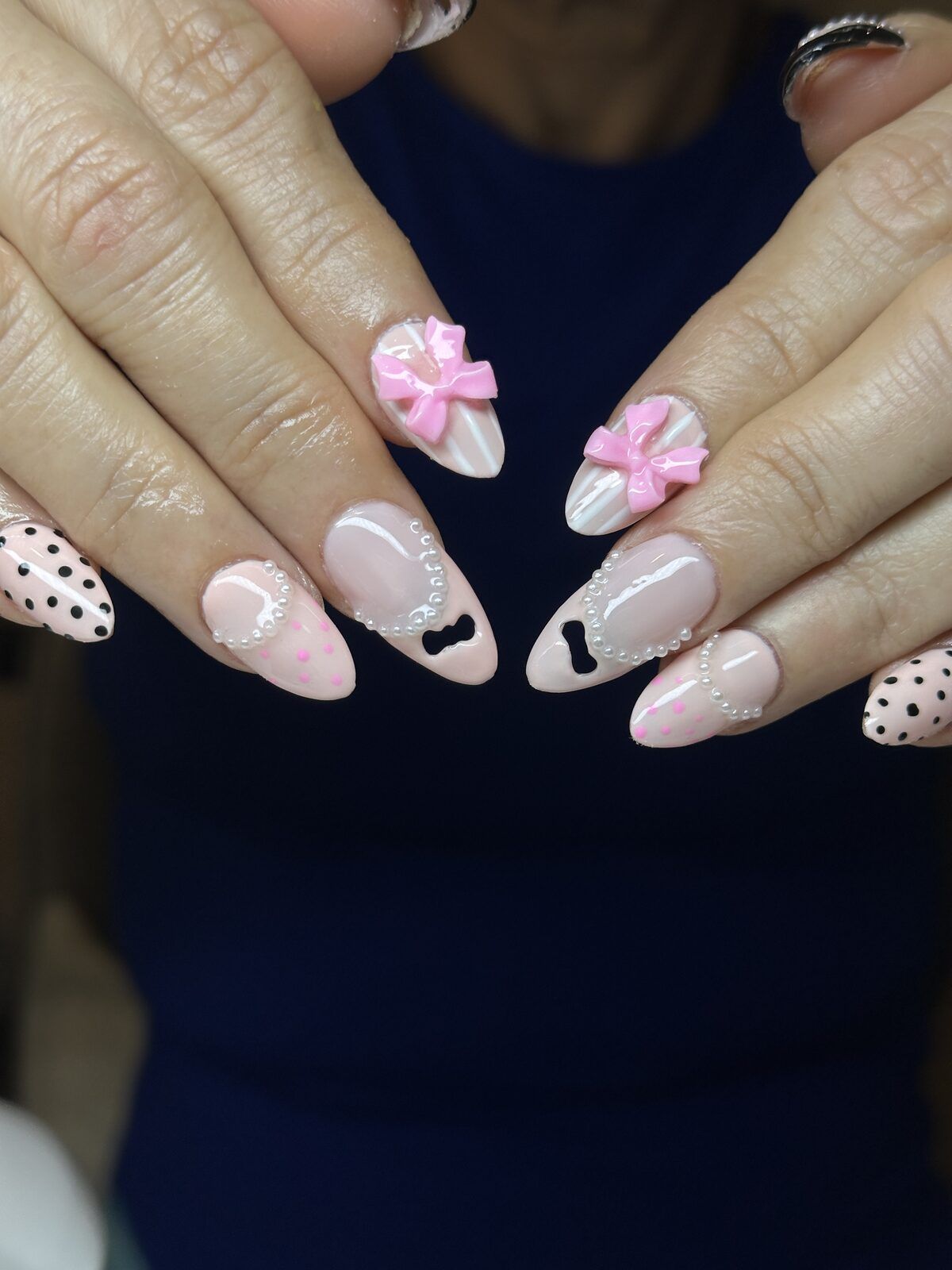 Gel X almond extensions nude pink with 3D bows and pearls - Wolf SGX Montreal